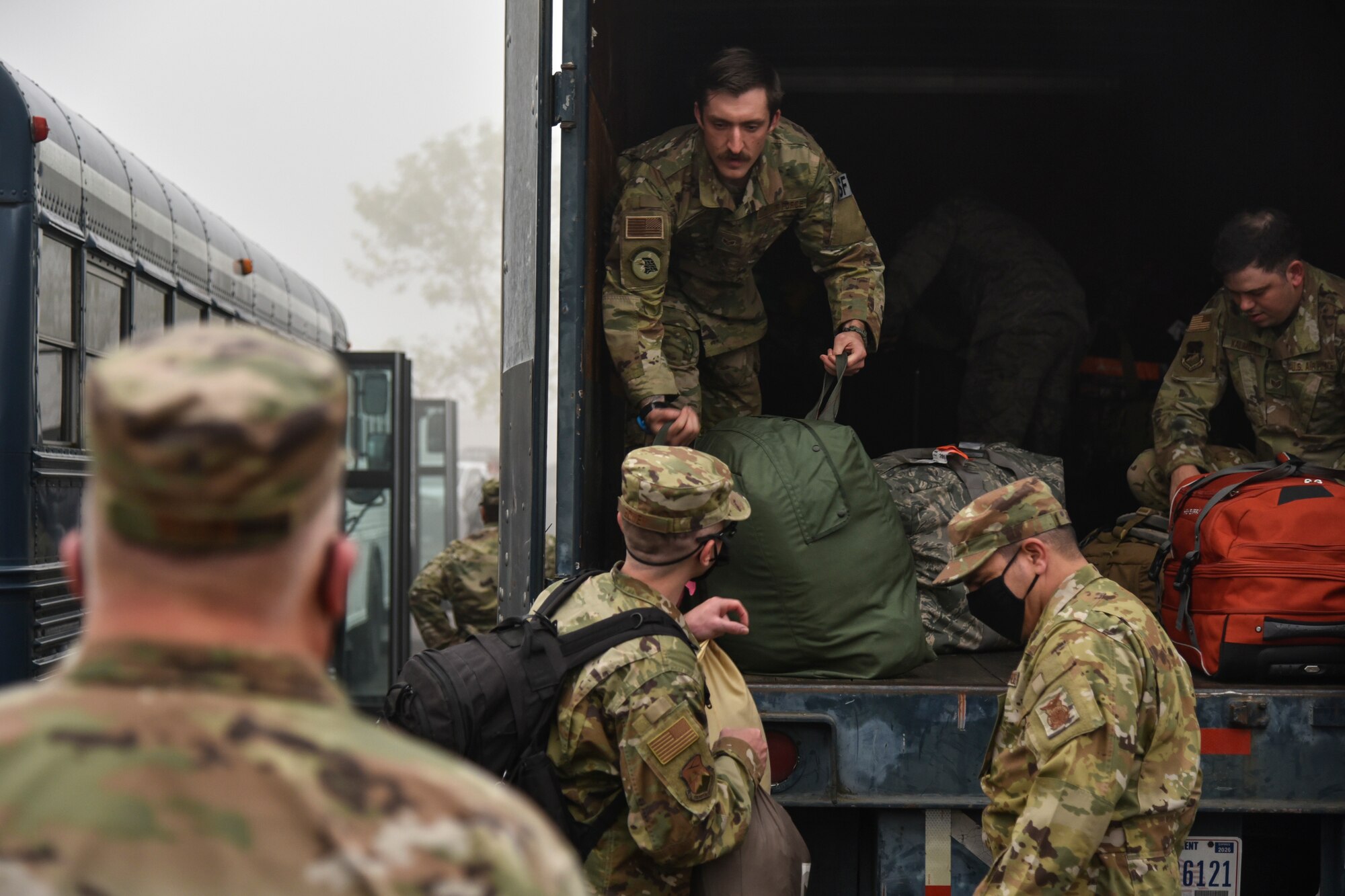 Oregon Air National Guard members from the 142nd Wing load their gear in a truck before leaving from the Portland Air National Guard Base, Portland, Ore., Sept. 13, 2020. The Airmen departed base in teams to support Operation Plan Smokey, an interagency wildfire relief effort. (U.S. Air National Guard photo by Senior Airman Valerie R. Seelye)