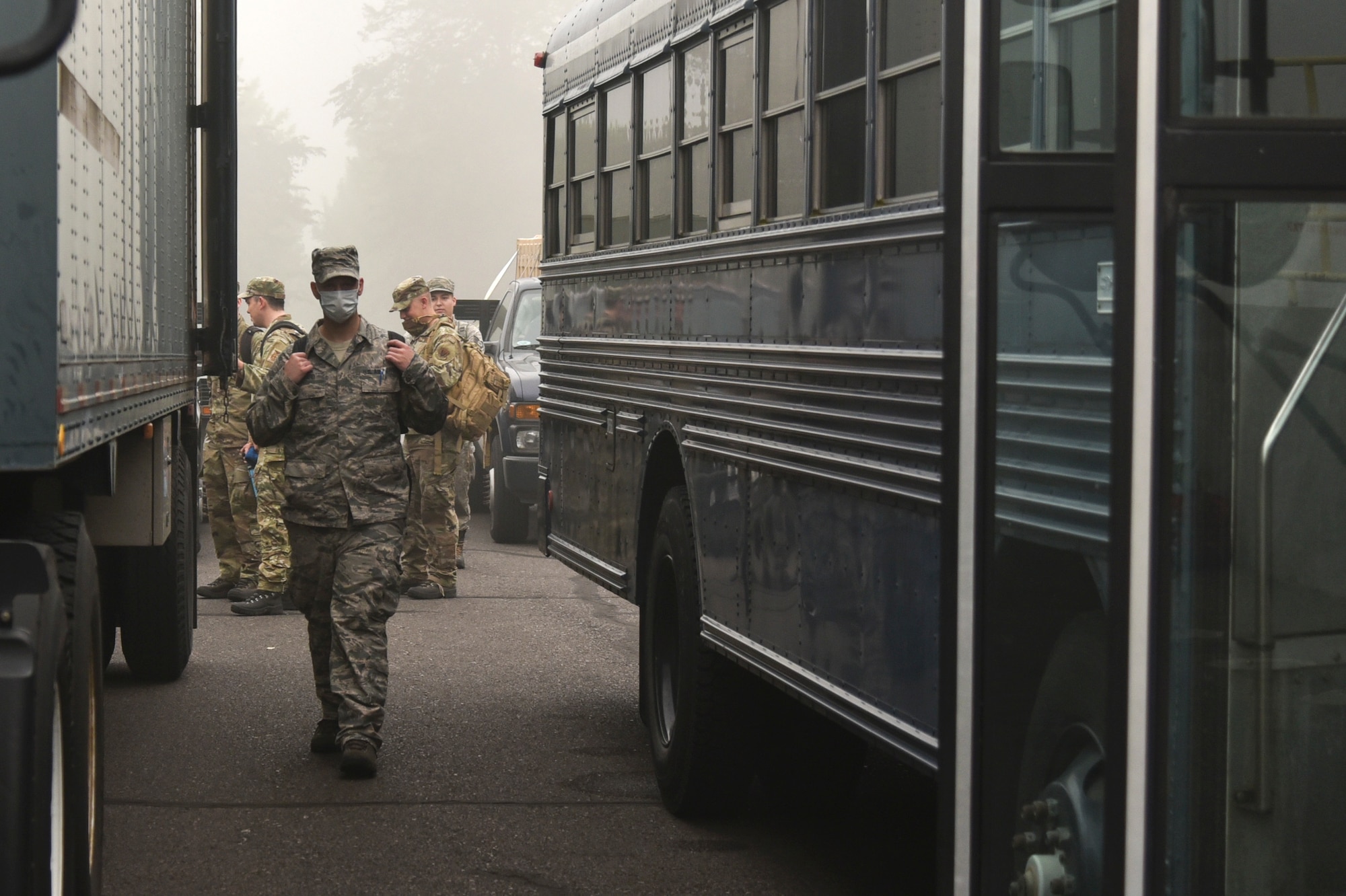 Oregon Air National Guard members from the 142nd Wing load busses before leaving from the Portland Air National Guard Base, Portland, Ore., Sept. 13, 2020, in support of Operation Plan Smokey. The Airmen previously received training to be ready to provide wildfire relief efforts in a moment’s notice. (U.S. Air National Guard photo by Senior Airman Valerie R. Seelye)
