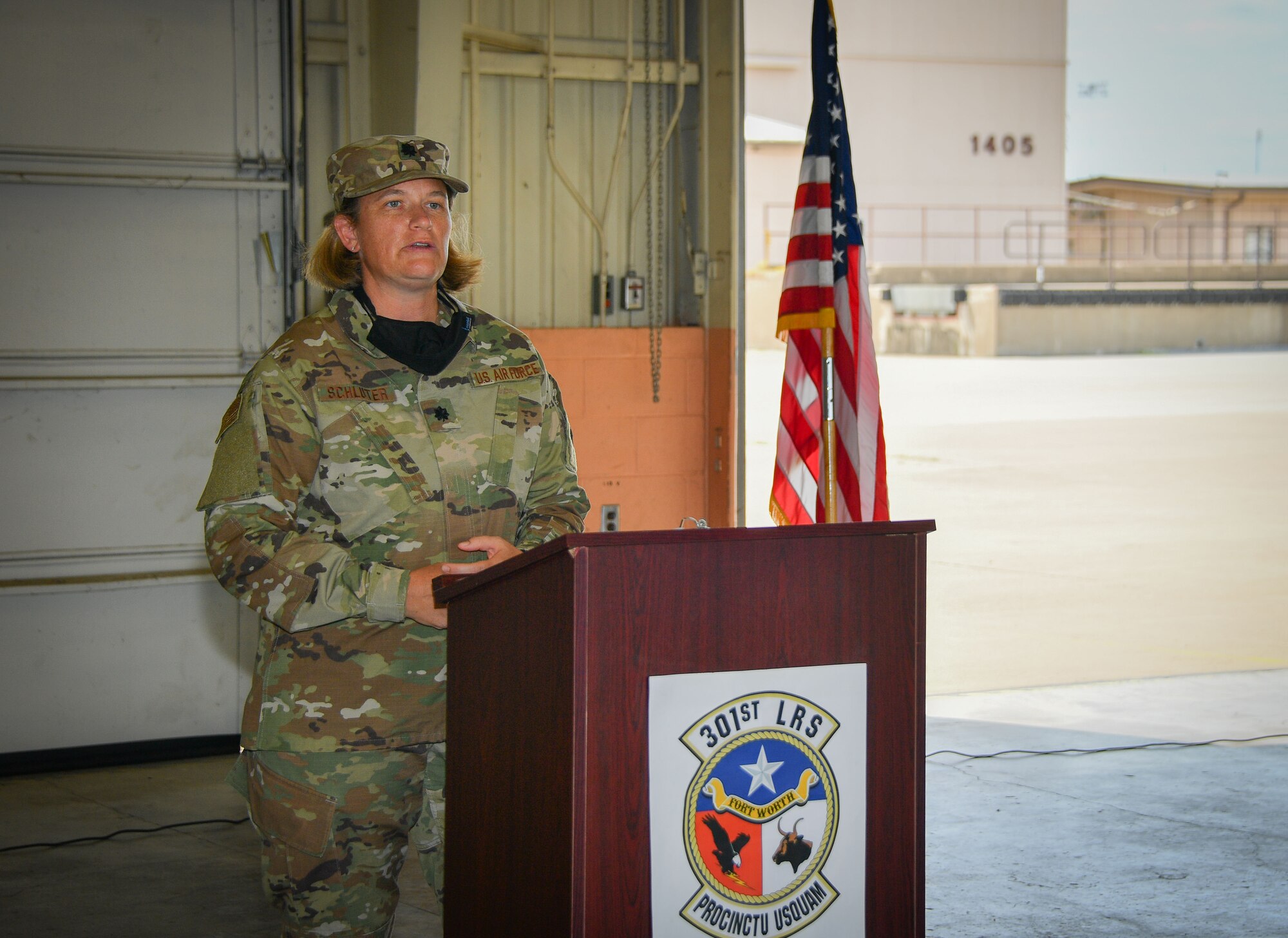 Lt. Col. Farrah Schluter, 301st Fighter Wing Logistics Readiness Squadron commander, addresses her Airmen during the 301st FW LRS assumption of command ceremony, September 13, 2020, at U.S. Naval Air Station Joint Reserve Base Fort Worth, Texas. She is responsible for 127 Traditional Reservists, Air Reserve Technicians, Active Guard Reserves, and civilian personnel. She is responsible for logistics plans, vehicle operations, vehicle maintenance, fuels, supply, and traffic management. (U.S. Air Force photo by Staff Sgt. Randall Moose)