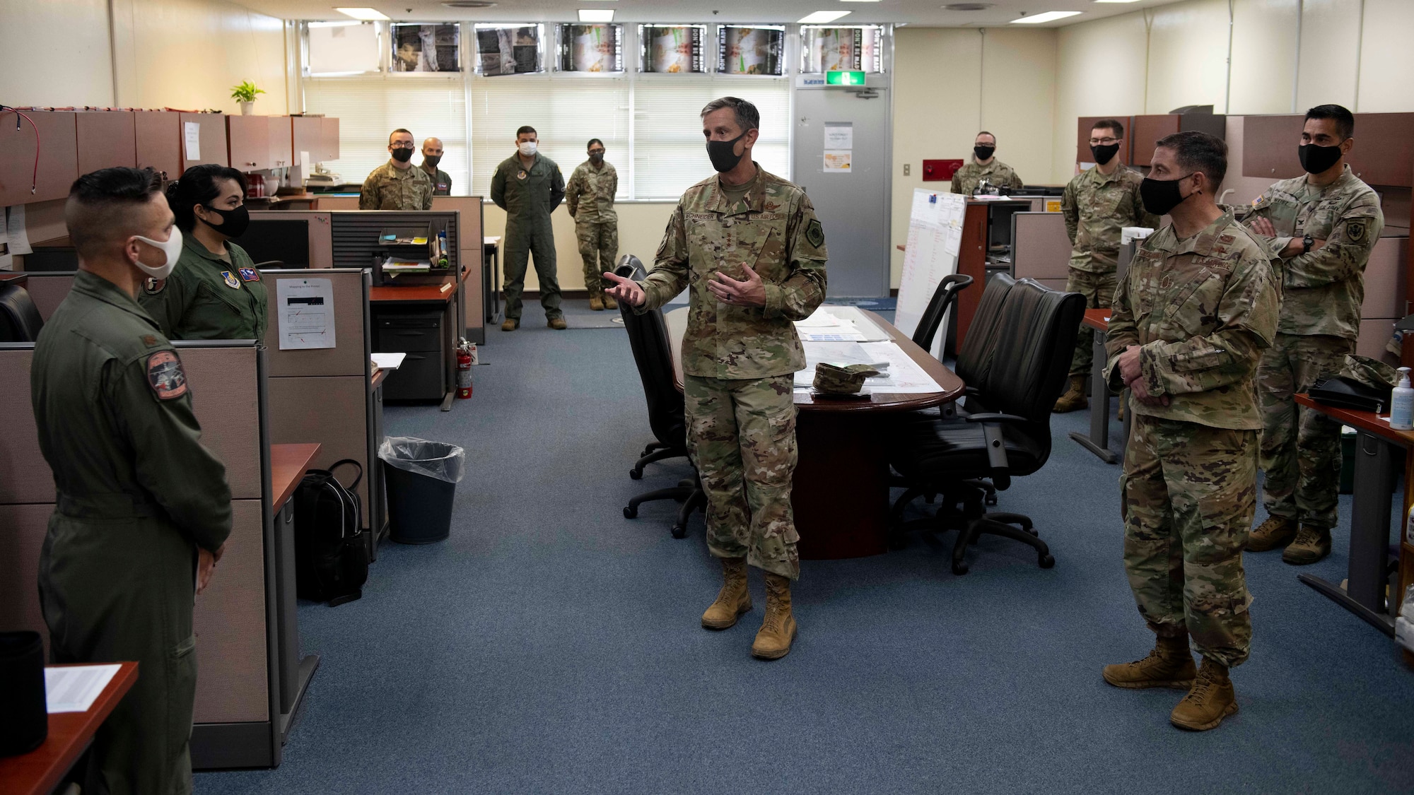 U.S. Air Force Lt. Gen. Kevin B. Schneider, U.S. Forces Japan and Fifth Air Force commander, engages in counter-COVID-19 operations discussion with members of the future operations cell Sept. 11, 2020, at Kadena Air Base, Japan. Lt. Gen. Schneider visited Team Kadena in order to address topics of concern and receive feedback on how Airmen are overcoming pandemic-related issues. (U.S. Air Force photo by Staff Sgt. Peter Reft)