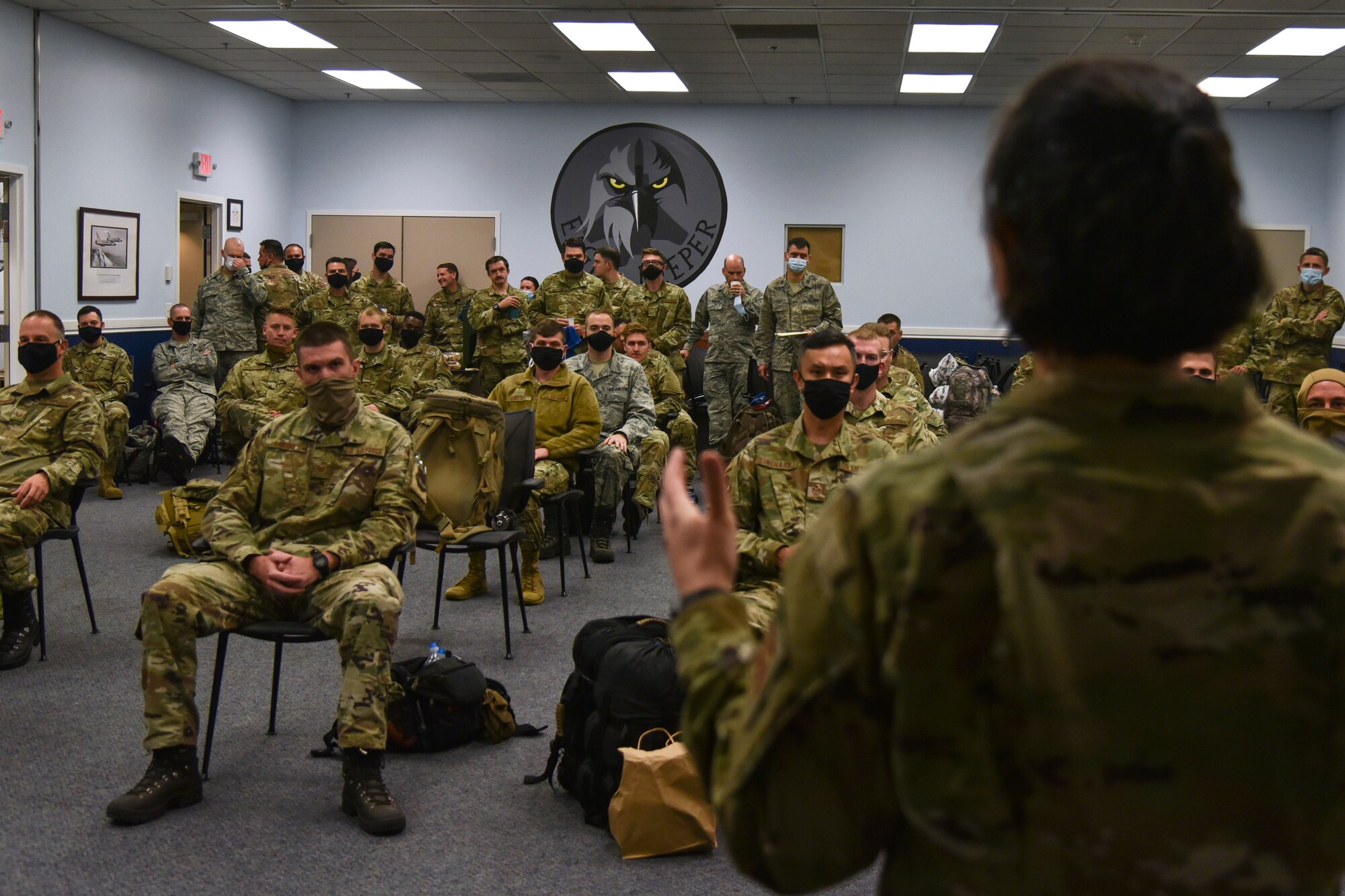 Oregon Air National Guard members from the 142nd Wing listen to a briefing before leaving from the Portland Air National Guard Base, Portland, Ore., Sept. 13, 2020, in support of Operation Plan Smokey. OPLAN Smokey requires Airmen to be ready in a moment’s notice to help with state-wide wildfire relief efforts. (U.S. Air National Guard photo by Senior Airman Valerie R. Seelye)