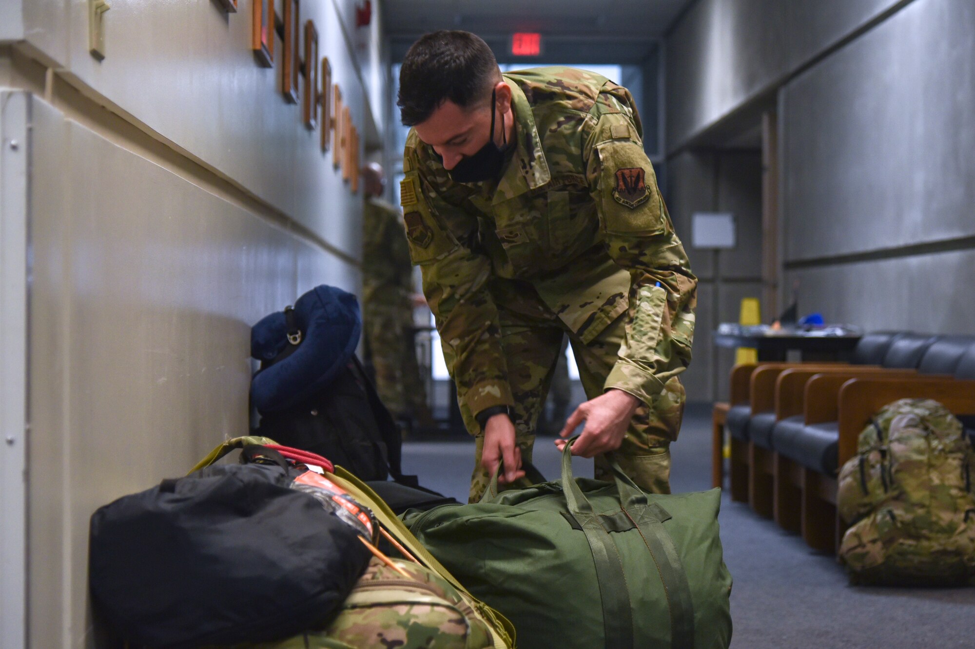 An Oregon Air National Guard member from the 142nd Wing packs his gear before leaving with a team of Airmen in support of Operation Plan Smokey at the Portland Air National Guard Base, Portland, Ore., Sept. 13, 2020. OPLAN Smokey tasks Oregon ANG members to help with firefighting efforts across the state. (U.S. Air National Guard photo by Senior Airman Valerie R. Seelye)