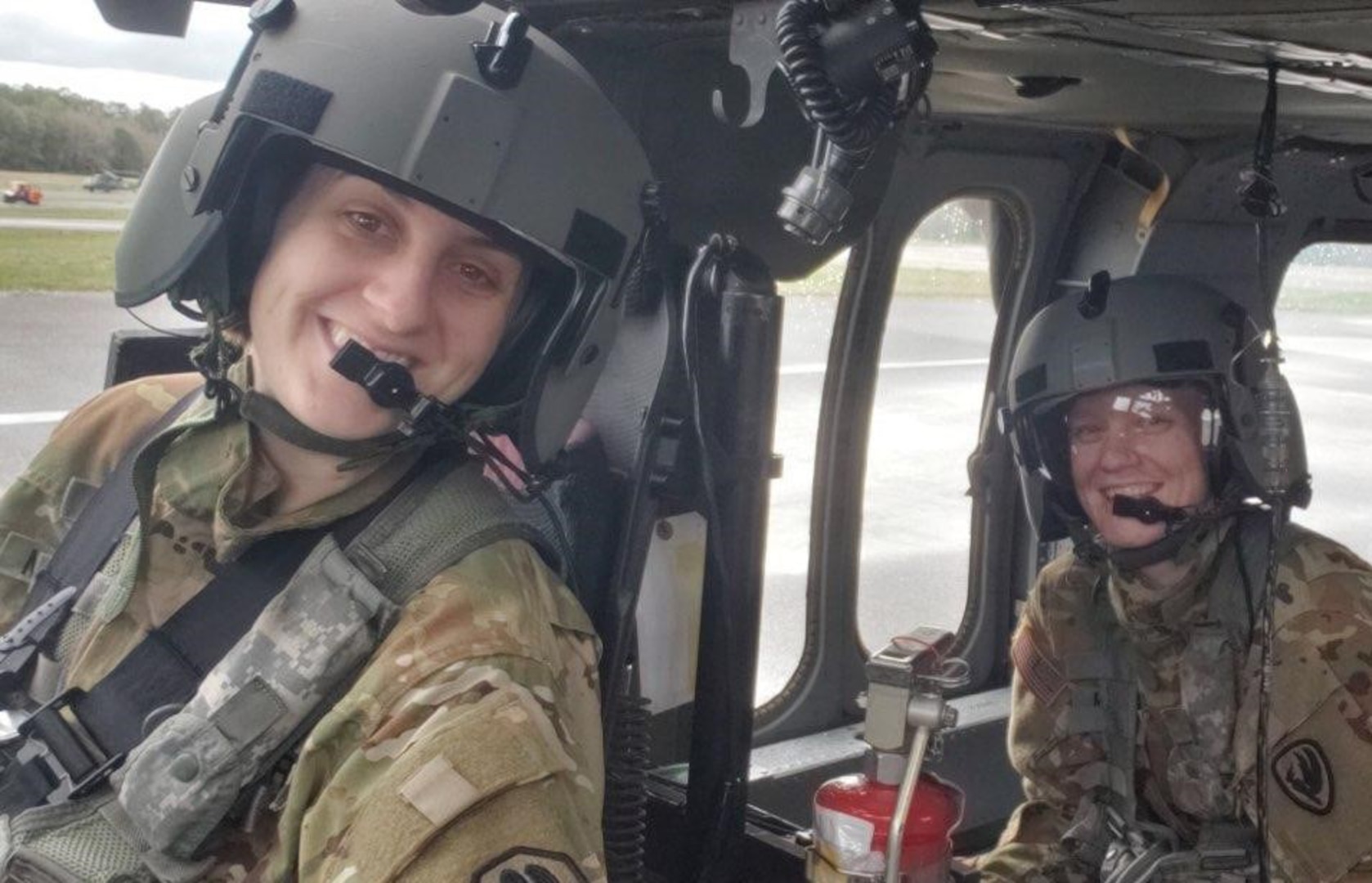 Warrant Officer Kayla Meadors, left, 28, with the 1-244th Assault Helicopter Battalion and one of the newest pilots in the Louisiana National Guard, responded to Hurricane Laura during emergency operations. She is shown in the cockpit of a helicopter Sept. 11, 2020.