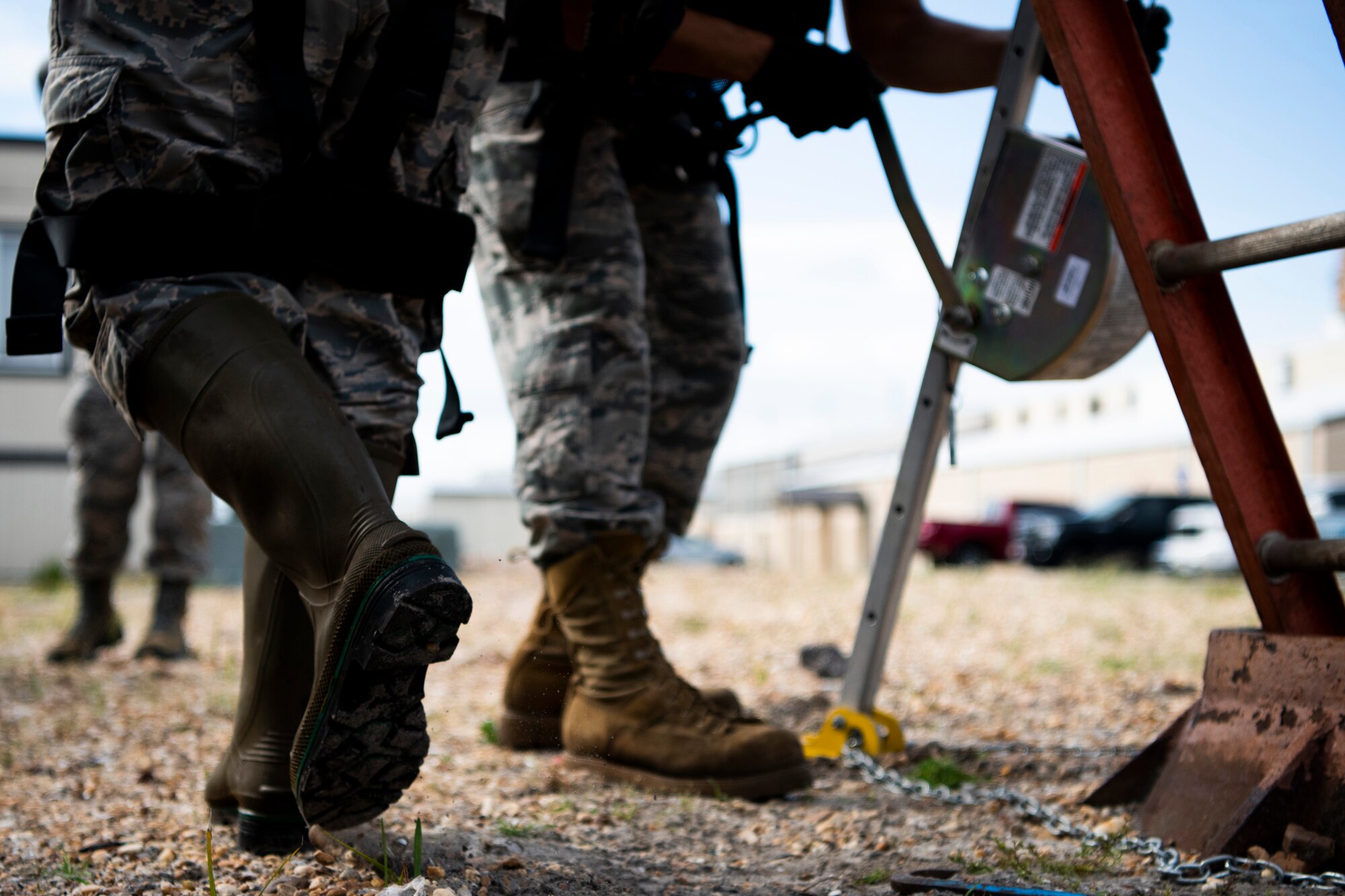 Cable antenna systems technicians with the 85th Engineering Installation Squadron assigned to Keesler Air Force Base, Mississippi, prepare to enter a manhole at Tyndall Air Force Base, Florida, Aug. 28, 2020. The 85th EIS is assisting the 325th Communications Squadron to move information transfer nodes from damaged buildings, which will improve network stability. (U.S. Air Force photo by Tech. Sgt. Clayton Lenhardt)