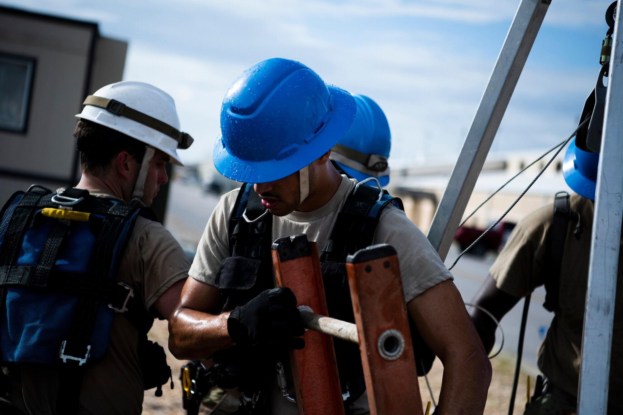 U.S. Air Force Airman 1st Class Emmanuel Jackson-Wilson, cable antenna systems technician with the 85th Engineering Installation Squadron assigned to Keesler Air Force Base, Mississippi, exits a manhole at Tyndall Air Force Base, Florida, Aug. 28, 2020. The 85th EIS has made multiple trips to Tyndall to assist the 325th Communications Squadron with relocating information transfer nodes. (U.S. Air Force photo by Tech. Sgt. Clayton Lenhardt)