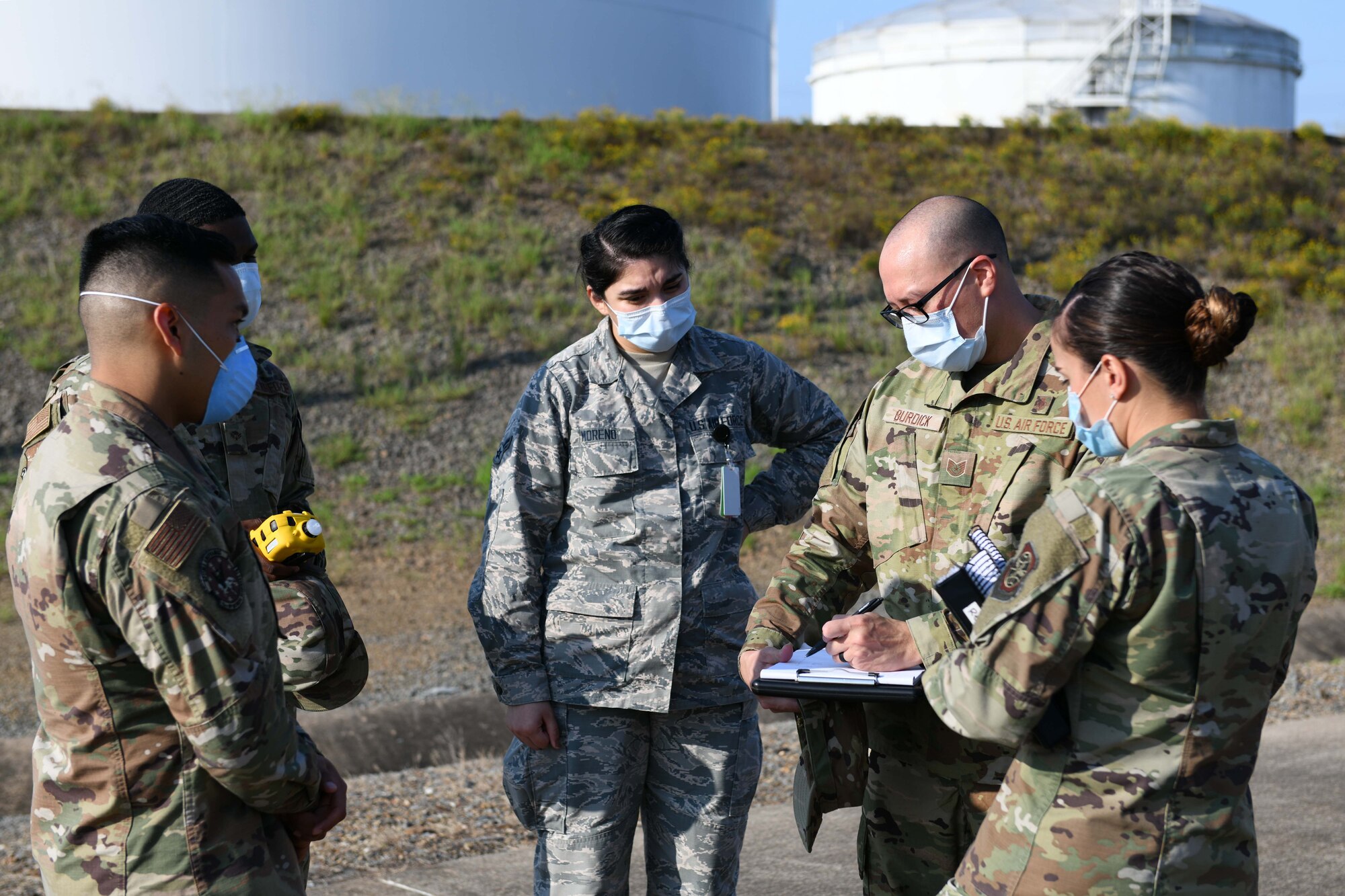 Airmen gather around for a briefing