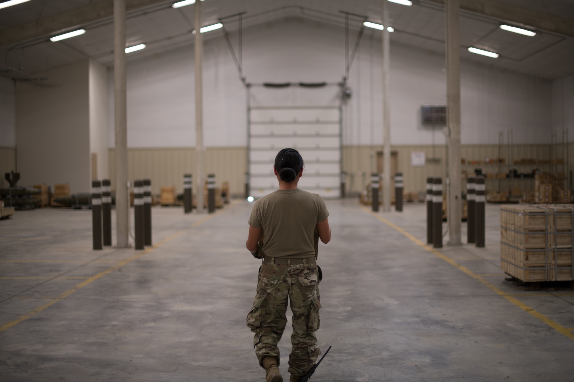 Senior Airman Marian Bock, 22nd Maintenance Squadron munitions flight custody accounts technician, transports a box of 5.56 mm ball ammunition inside an above ground magazine facility Aug. 28, 2020, at McConnell Air Force Base, Kansas. Munitions flight personnel are required to transport their stock to a different facility for inspection based on the life cycle of the ammunition. (U.S. Air Force photo by Senior Airman Skyler Combs)