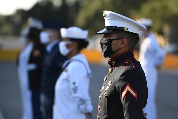 U.S. Marine Private 1st Class Horus Florestrujillo, Keesler Marine Detachment student, stands in formation during a 9/11 memorial ceremony hosted by the Center for Naval Aviation Technical Training Unit Keesler in front of the 81st Training Wing headquarters building at Keesler Air Force Base, Mississippi, Sept. 11, 2020. The event honored those who lost their lives during the 9/11 attacks. (U.S. Air Force photo by Kemberly Groue)