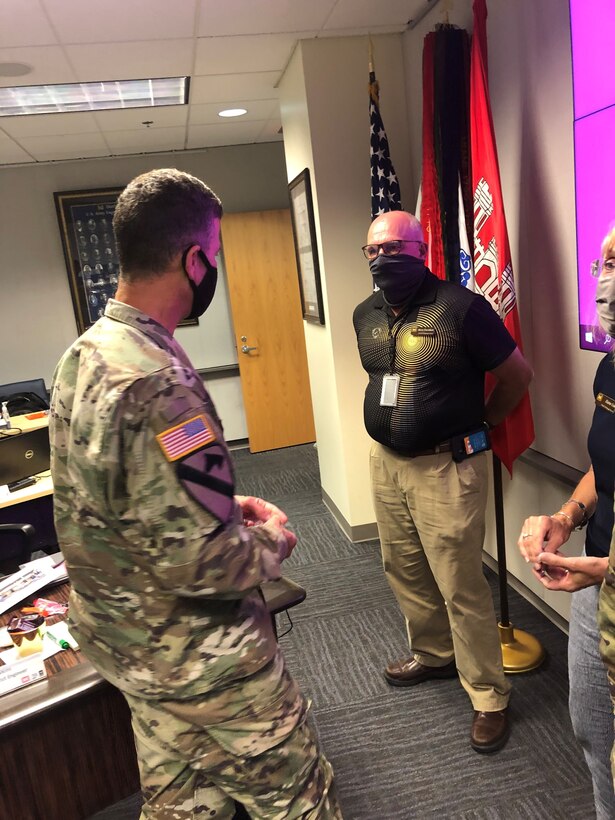 The Great Lakes and Ohio River Division Commander Maj. Gen. Robert F. Whittle Jr. presents Pittsburgh District Steve Davidson with a Commanders Coin Sept. 1, 2020. A Commanders Coins are often presented to a service member or civilian for an excellent job well done, or for an award for doing something outstanding