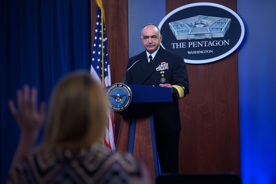 A man stands at a podium.