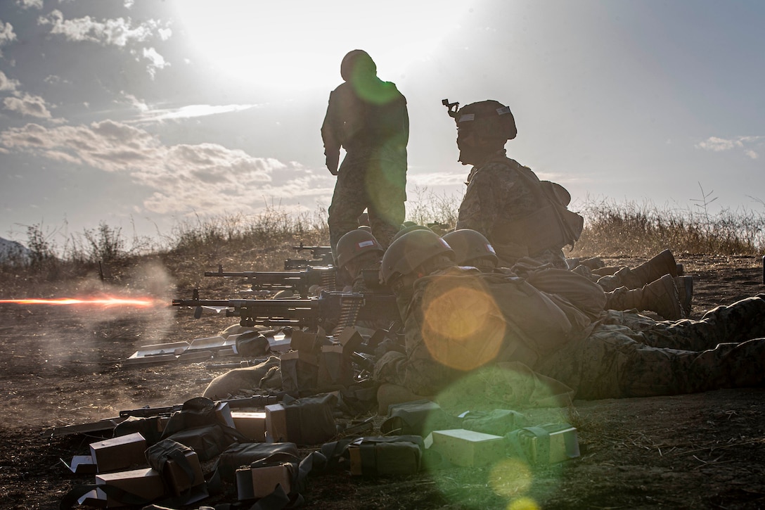 U.S. Marines fire M240 medium machine guns during live-fire training at Range 218A on Marine Corps Base Camp Pendleton, Calif., Aug. 18.