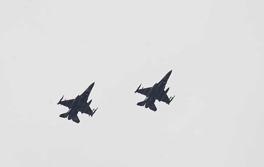 Two F-16 Fighting Falcons, assigned to the 18th Aggressor Squadron, fly over the Joint Pacific Alaska Range Complex (JPARC) on their way to support exercise Valiant Shield on Eielson Air Force Base, Alaska, Sept. 8, 2020. Valiant Shield 20 provides an effective, flexible and capabilities centered force, enabling real-world proficiency in response to a variety of crises. (U.S. Air Force photo by Staff Sgt. Sean Martin)