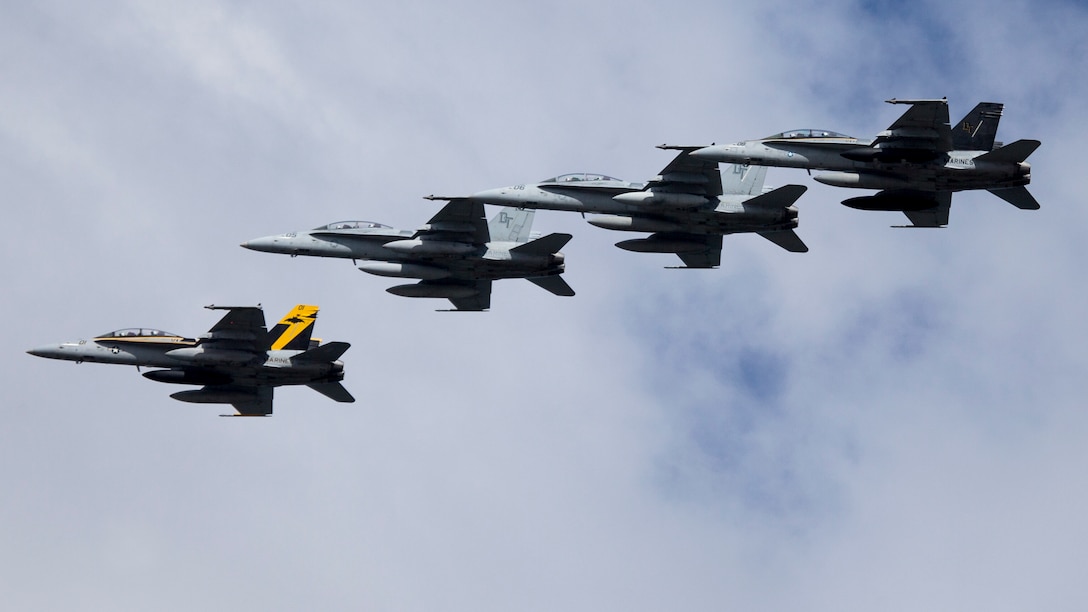 U.S. Marine Corps F/A-18D Hornets fly in formation near Marine Corps Air Station Iwakuni, Japan, Aug. 26.