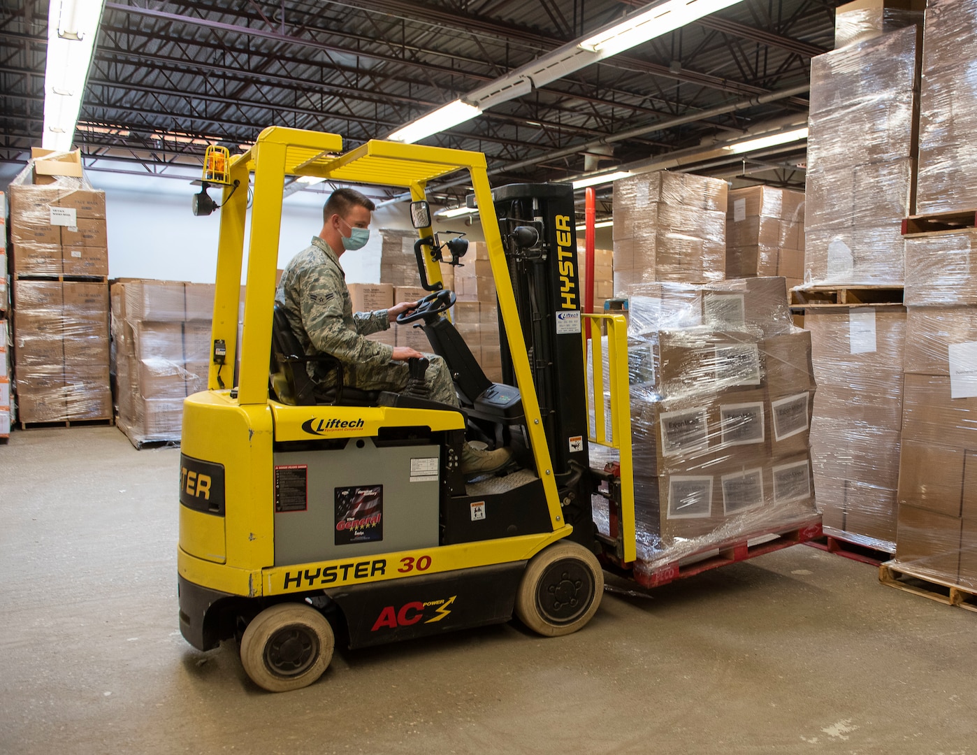 U.S. Air Force Airmen 1st Class Brett Woods from the 158th Fighter Wing, Vermont Air National Guard, maneuvers a forklift at the Strategic National Stockpile warehouse in Colchester, Vermont, August 27, 2020. The Defense Logistics Agency is working with the Federal Emergency Management Agency and the Department of Health and Human Services to replenish the nearly depleted SNS with personal protective equipment as the nation continues responding to COVID-19.