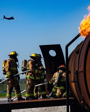 Firefighters from Rickenbacker Air National Guard prepare to breach Youngstown Air Reserve Station’s burn pit, Sept. 9, 2020. About 40 Citizen Airmen from RANG’s fire department came to the 910th Airlift Wing, Sept. 8-10, to do their annual live-fire training.