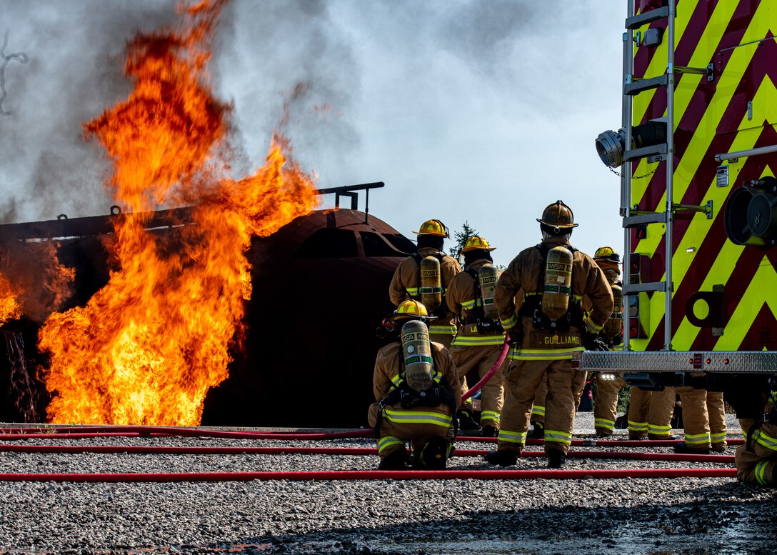 Firefighters from Rickenbacker Air National Guard ready to fight an external aircraft fire, Sept. 9, 2020, at Youngstown Air Reserve Station’s burn pit. About 40 Citizen Airmen from RANG’s fire department came to the 910th Airlift Wing, Sept. 8-10, to do their annual live-fire training.