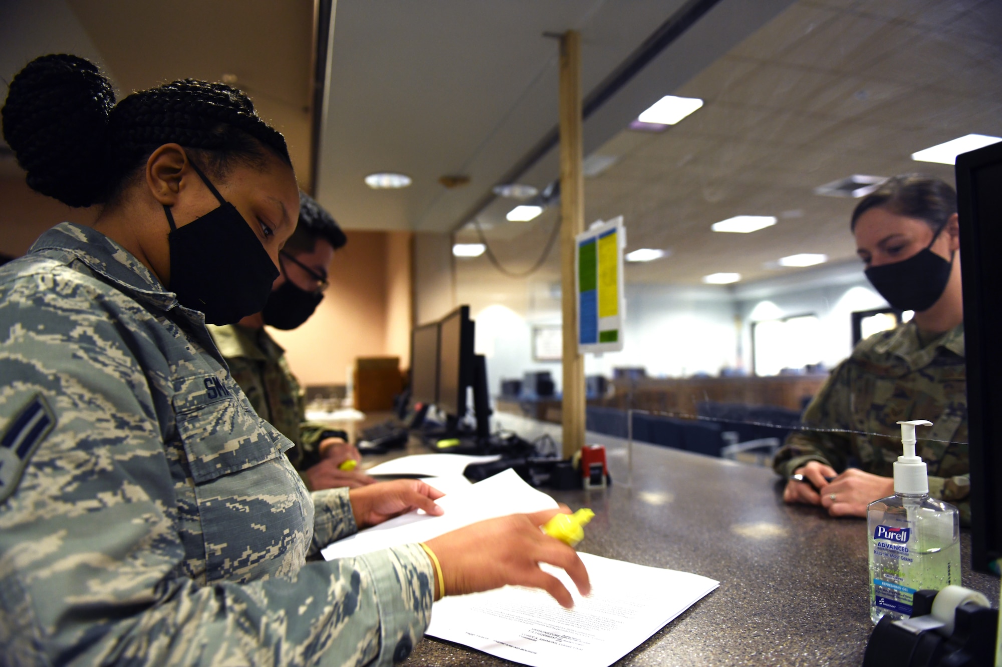 Airman 1st Class Timera Smalley (left), 9th Comptroller Squadron (CPTS) financial technician, browses through a travel voucher Sep. 9, 2020, at Beale Air Force Base, California. Smalley and two other Airmen were sent to Travis Air Force Base to assist the 60th CPTS in processing travel vouchers after the mandatory evacuations were lifted. (U.S. Air Force photo by Airman 1st Class Luis A. Ruiz-Vazquez)