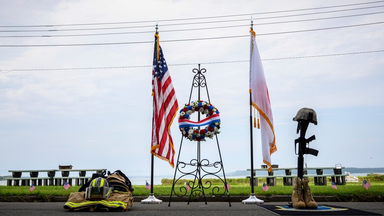 A wreath is displayed in honor of the lives lost on 9/11 at Misawa Air Base, Japan, Sept. 11, 2020. Airmen and families from across the base, including young children attended the ceremony and memorial climb in efforts to not only educate but also to ensure we never forget the sacrifices made that day. (U.S. Air Force photo by Airman 1st Class China M. Shock)