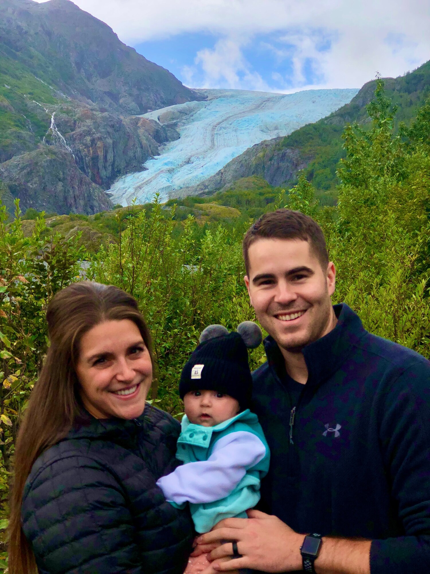 Capt. (Dr.) Christopher Weisgarber takes a photo with his family.