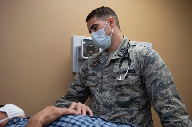 Capt. (Dr.) Christopher Weisgarber listens to his patient’s concerns.