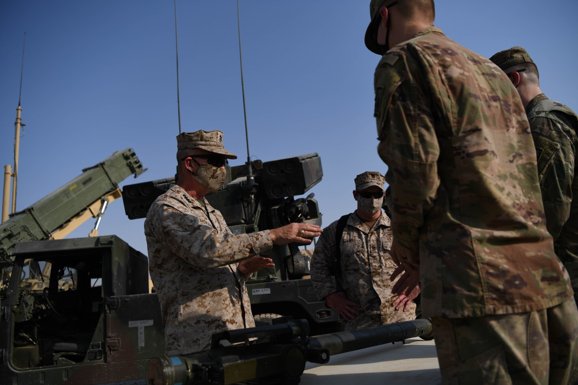 U.S. Marine Corps Gen. Kenneth F. McKenzie Jr., United States Central Command commander, talks about capabilities of the Avenger Air Defense System with Army Soldiers during a visit to the Alpha Battery 5-52 Air Defense Artillery Battalion, Sept. 13, 2020, at Al Dhafra Air Base, United Arab Emirates.
