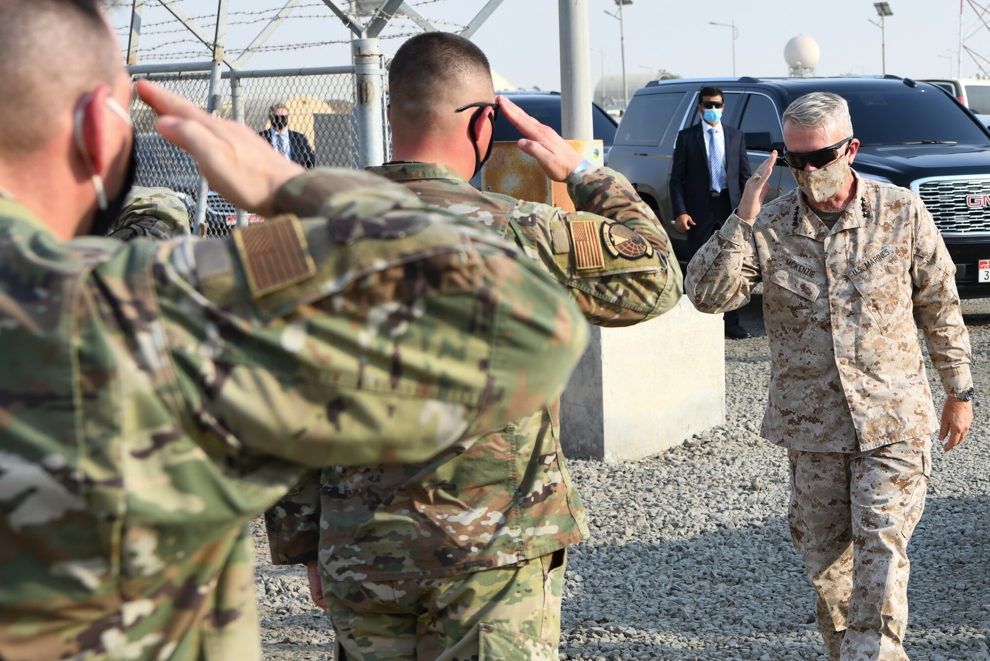 U.S. Marine Corps Gen. Kenneth F. McKenzie, commander, U.S. Central Command, returns salutes from Airmen at Al Dhafra Air Base, United Arab Emirates, Sept. 13, 2020.
