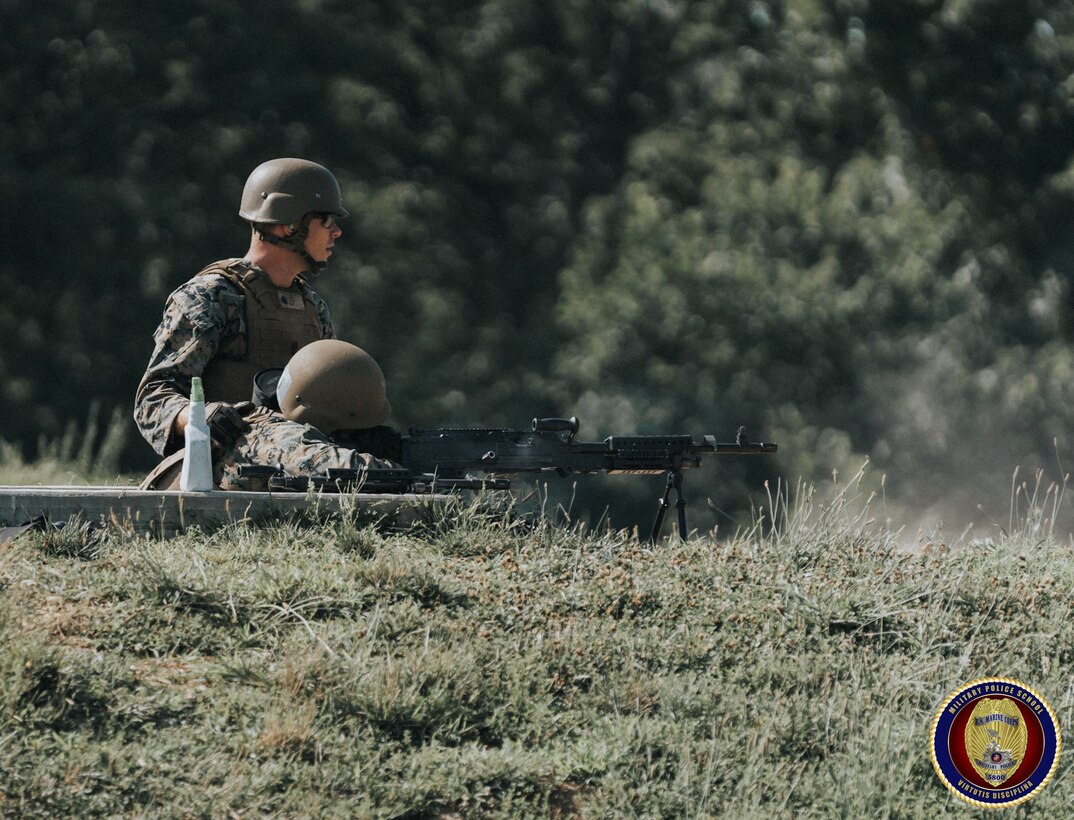 Sgt Larue observes impacts on target as he coaches a Military Police student on employing the M-240 machine gun.