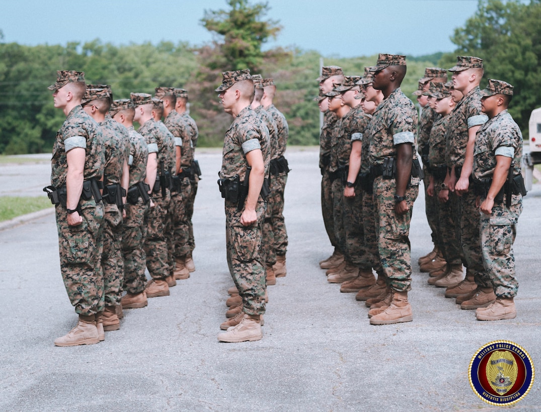 Students stand in formation as they learn how to conduct guard mount. Guard mount is a formal tradition in which Military Police personnel form for inspection prior to assuming their duties on the watch. This inspection is used to ensure Military Police personnel are mentally and physically fit for duty.