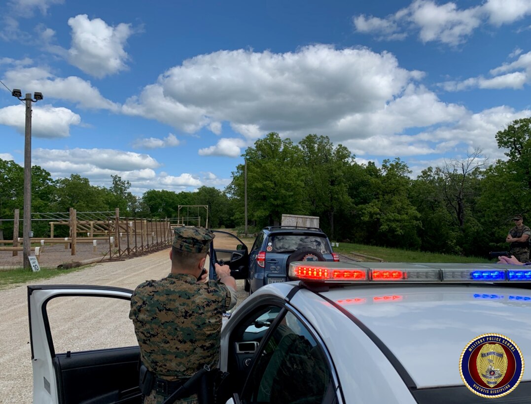 Students of the Military Police Basic Course conduct a felony traffic stop in which they must remove and an armed and dangerous subject from their vehicle and take them into custody.