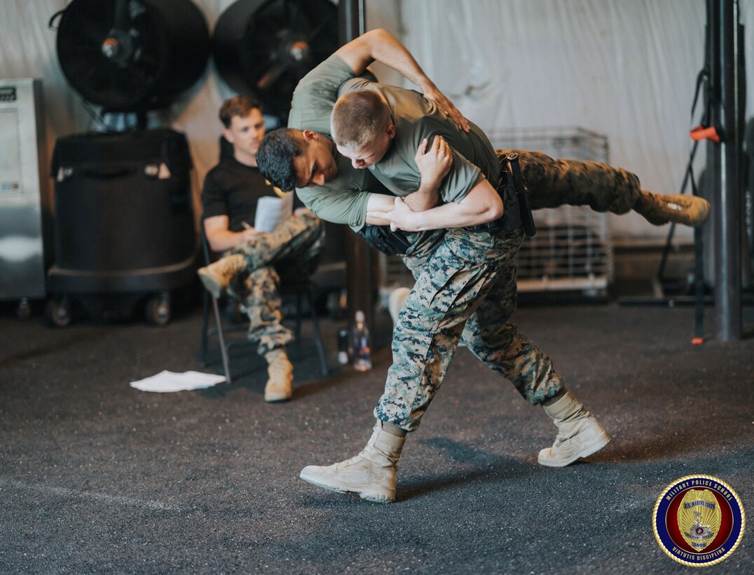 Sgt Morgan evaluates students of the Military Police Basic Course in executing defensive tactics and martial arts techniques.