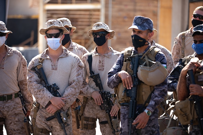 U.S. Marines with Special Purpose Marine Air-Ground Task Force – Crisis Response – Central Command and Royal Jordanian Marines receive a safety brief before beginning close quarters battle training during Exercise INFINITE DEFENDER 20 in Jordan, Sept. 1, 2020. Exercise INFINITE DEFENDER 20 is an annual, bilateral explosive ordnance disposal and maritime security exercise between U.S. 5th Fleet and the Royal Jordanian Navy to enhance mutual capabilities and interoperability. (U.S. Marine Corps Photo by Cpl. Robert Kuehn)