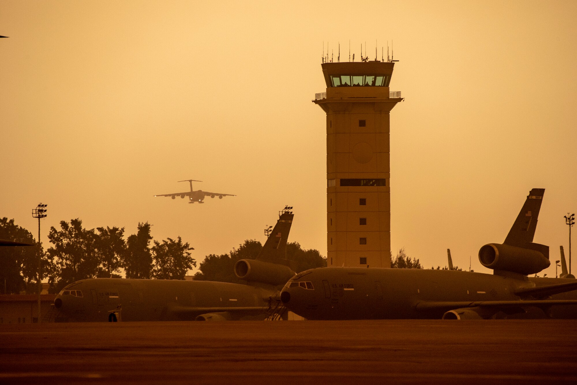 A U.S. Air Force C-5M Super Galaxy prepares to land on the runway Sept. 9, 2020, at Travis Air Force Base, California. Wildfires across California propelled smoke and ash into the troposphere, impacting air quality. (U.S. Air Force photo by Heide Couch)