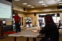 Norfolk Naval Shipyard (NNSY) Executive Development Program (EDP) Cadre 9 team member General Arrangements Branch (Code 254) Naval Architect Rachel Yarasavich shadowed NNSY Historian Marcus Robbins during his history presentation for new employees at America's Shipyard.