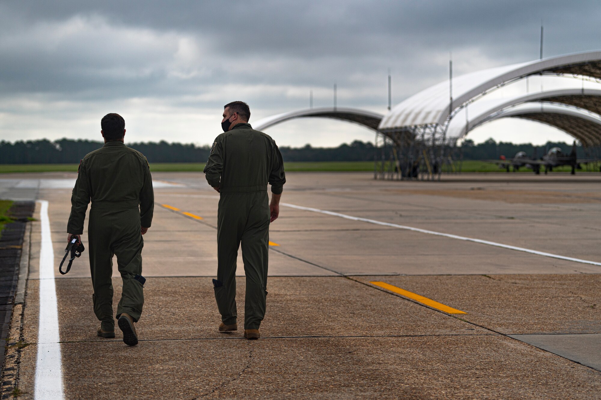 A photo of Airmen walking to an aircraft