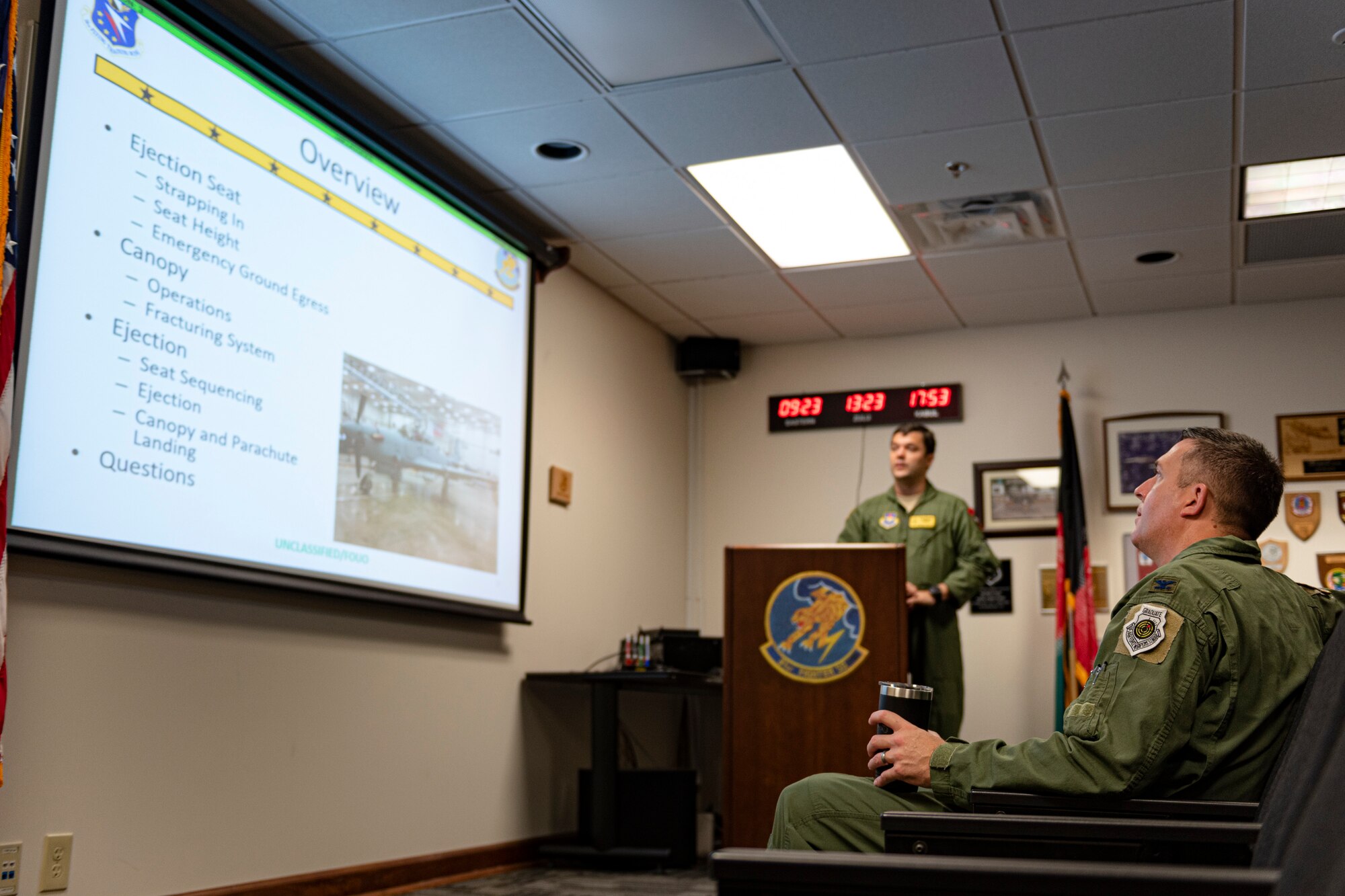 A photo of the 23d Wing commander attending a brief