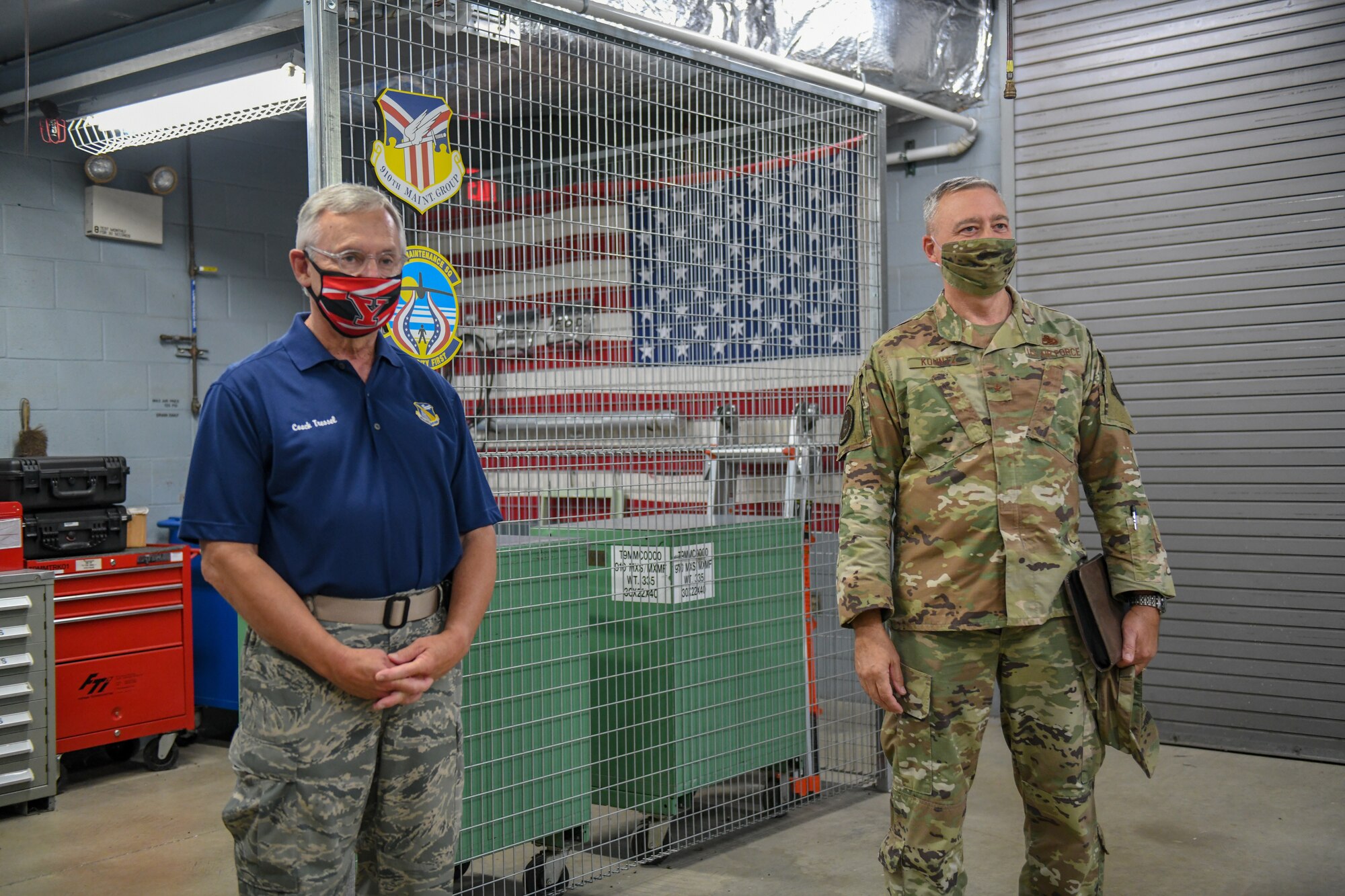 Brig. Gen. William Kountz, director of logistics, engineering and force protection for Air Force Reserve Command, and Jim Tressel, Youngstown State University’s president, watch a presentation given by Reserve Citizen Airmen assigned to the 910th Aircraft Maintenance Squadron on the 910th Airlift Wing’s additive manufacturing capabilities, Sept. 13, 2020, at Youngstown Air Reserve Station, Ohio. Kountz spent the day at YARS visiting squadrons to learn about their missions and gain a better understanding of how AFRC can assist. Tressel works closely with the installation as YSU finds new ways to provide opportunities to its students.