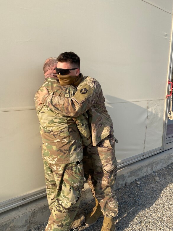 Spc. Michael Lane, an M1 armor crewmen with 1st Battalion, 145th Armor Regiment, greets his dad 1st. Sgt. Richard Lane for the first time since his Call to Duty ceremony in 2019.  Spc. Lane will be heading home soon while his father begins his final overseas assignment with 1st Battalion, 137th Aviation Regiment.