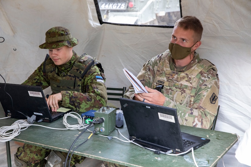 2nd Lt. Hemer of 1st Battalion, 6th Field Artillery Regiment and an Estonian Soldier work together in the Tactical Operation Center during a  live fire exercise with Estonian Defense Force in Tapa, Estonia Sept. 5, 2020.