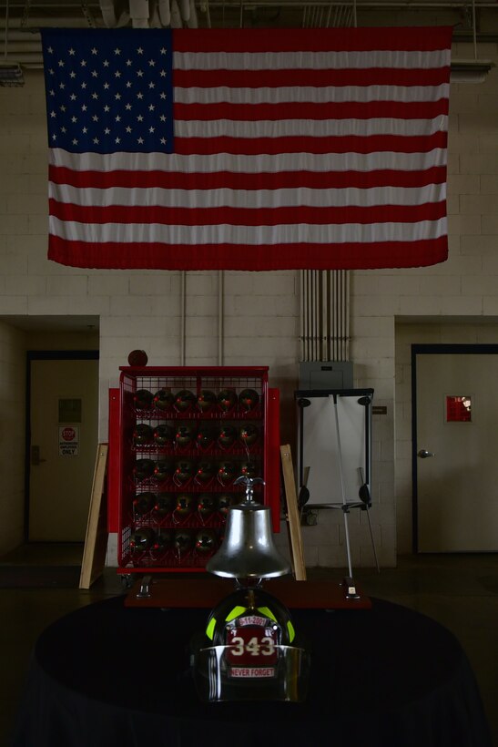 A ceremonial table containing a bell and helmet are set up in preparation for a remembrance ceremony at Seymour Johnson Air Force Base, North Carolina.