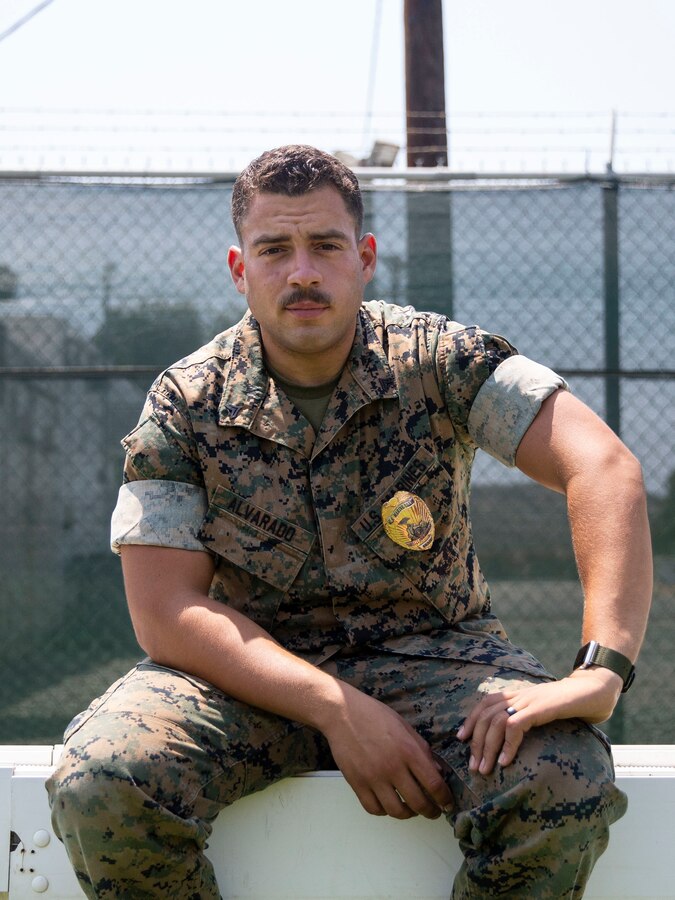 Cpl. Jeremy Alvarado, a military working dog trainer and handler with the Provost Marshal’s Office, Security and Emergency Services Battalion, Marine Corps Base Camp Pendleton, poses for a photo at the PMO kennels. Alvarado believes that honoring Hispanic heritage is important in broadening our understanding of each other and important to the diversity within Hispanic culture itself. Alvarado is a native of Yauco, Puerto Rico. (U.S. Marine Corps photo by Lance Cpl. Angela Wilcox)