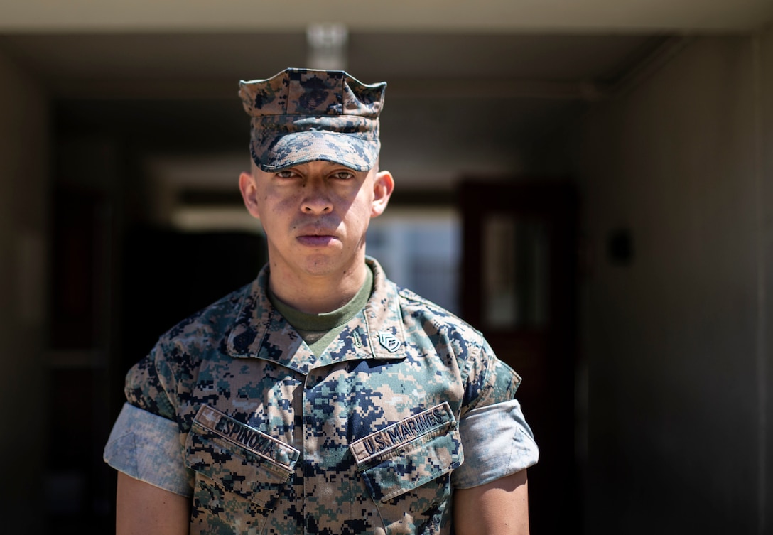 Gunnery Sgt. Milton Espinoza, the staff noncommissioned officer in charge of Installation Personnel Administration Center, Outbound (Separations), poses for a photo in front of his workplace. Espinoza lived in Tegucigalpa, Honduras until his teenage years, when he came to Miami, Florida to finish high school. He joined the United States Marine Corps upon graduation. (U.S. Marine Corps photo by Lance Cpl. Angela Wilcox)