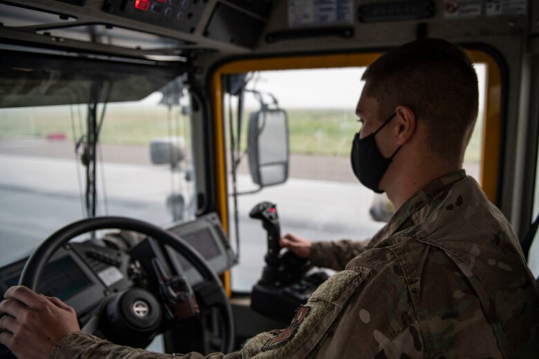 97th Civil Engineer Squadron removes runway rubber.