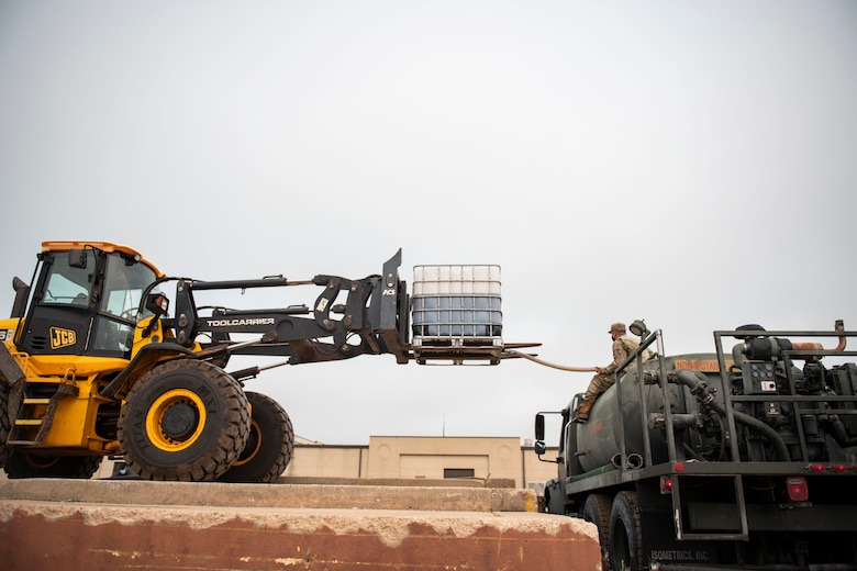 97th Civil Engineer Squadron removes runway rubber.