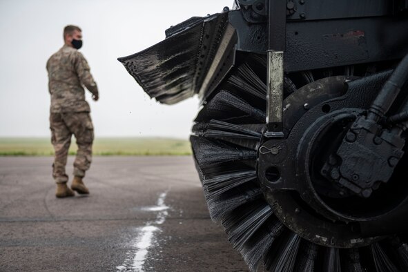 97th Civil Engineer Squadron removes runway rubber.