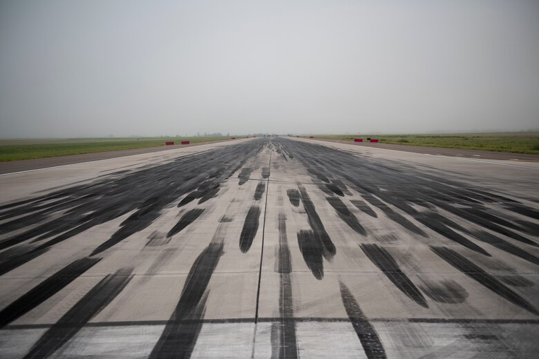 97th Civil Engineer Squadron removes runway rubber.