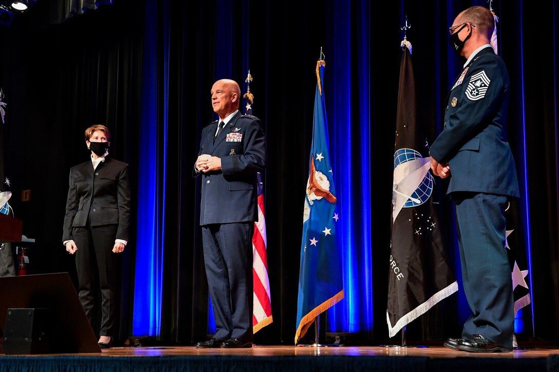 Chief of Space Operations Gen. John W. Raymond, center, flanked by Secretary of the Air Force Barbara M. Barrett, left, and Chief Master Sgt. Roger A. Towberman, senior enlisted advisor of U. S. Space Force, delivers remarks after a ceremony at the Pentagon transferring airmen into the Space Force, Arlington, Va., Sept. 15, 2020. About 300 airmen at bases worldwide, including 22 in the audience, transferred during the ceremony.  (U.S. Air Force photo by Eric R. Dietrich)
