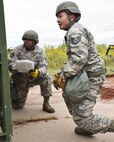 Tech. Sgt. Orlando Wright (left), 931st Civil Engineer Squadron Power Pro craftsman,  and Tech. Sgt. Khoa Nguyen (right), 931st CES Heating, Ventilation, and Air Conditioning craftsman, test set up a reverse osmosis water purification unit during a routine operational readiness exercise Sept. 11, 2020, at McConnell Air Force Base, Kansas.  The three-day exercise included Airmen from all 931st Air Refueling Wing groups, and was meant to evaluate each unit’s operational readiness.