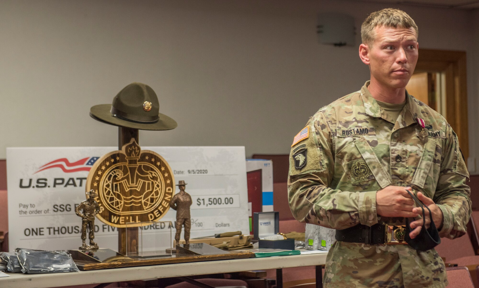 U.S. Army Staff Sgt. Erik A. Rostamo, 2020 Drill Sergeant of the Year, provides remarks during his recognition ceremony Sept. 10, at Fort Eustis, Virginia. The DSOY is a servant leader who is tasked to assist and advise drill sergeants throughout the Initial Entry Training Enterprise. (U.S. Air Force photo by Staff Sgt. Joshua Magbanua)