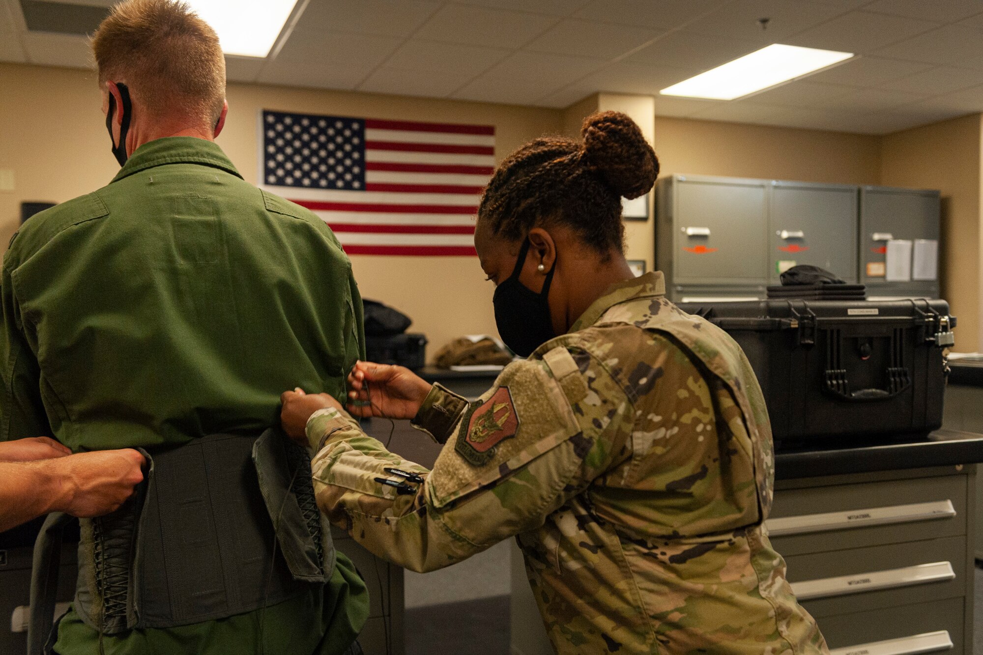 Photo of Col. Schultz being fitted for life support