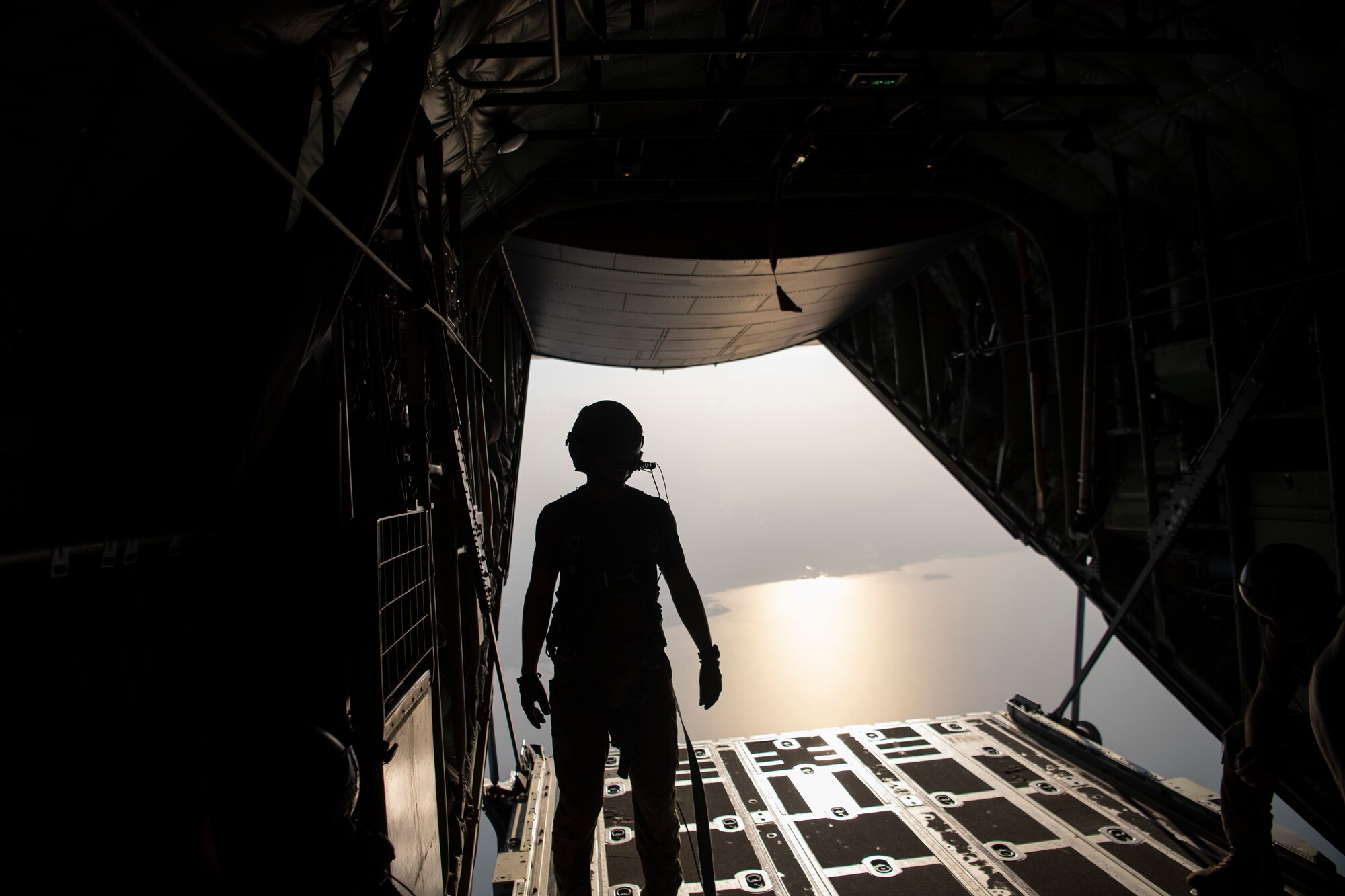 A person looks out a plane